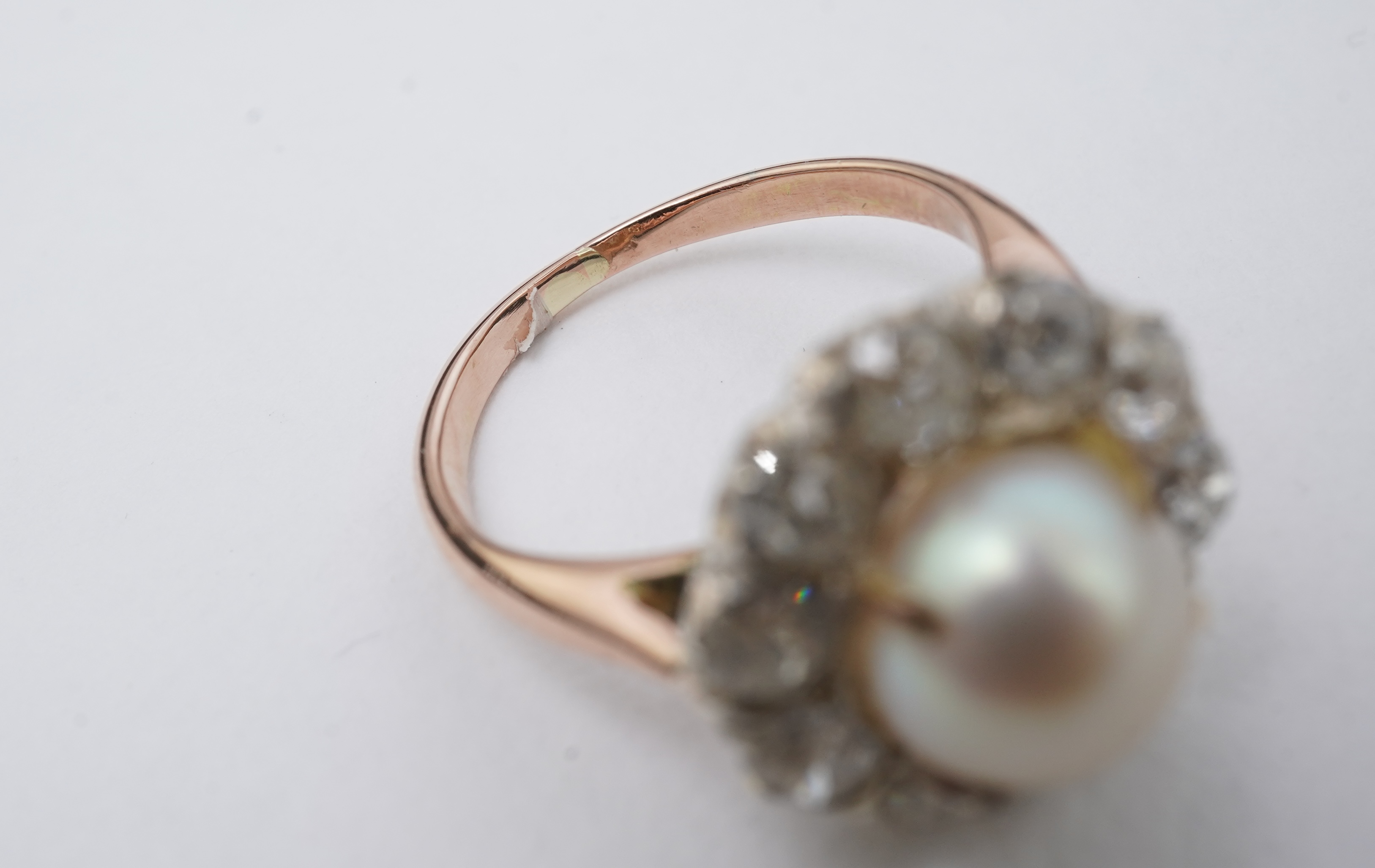 A cultured pearl and diamond ring